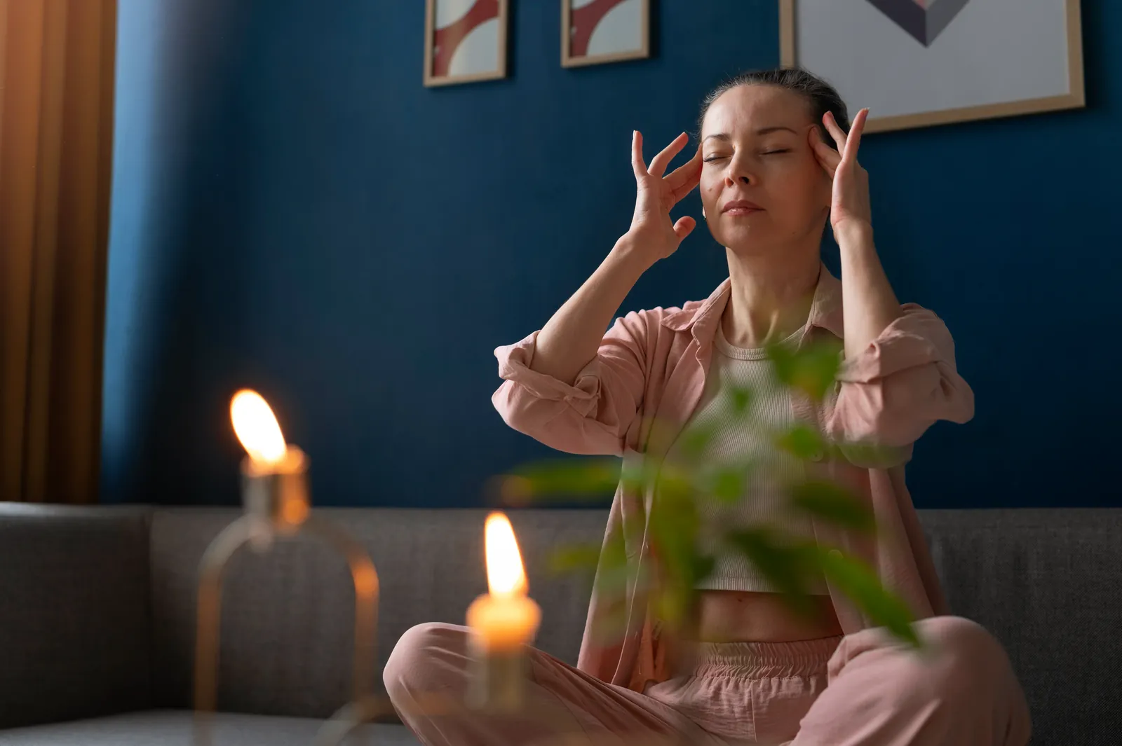 A woman sitting calmly with eyes closed, pausing deliberately before acting