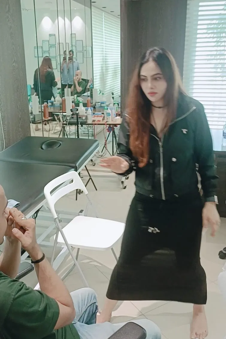 Vibha Jain explaining a relaxation technique to a client during a practice session